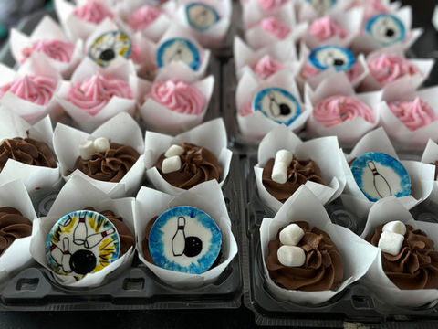 Bowling themed cupcakes with hand drawn bowling medallions on edible wafers in chocolate and vanilla.