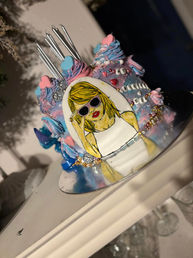 Taylor Swift themed birthday cake with hand drawn image of Taylor Swift.