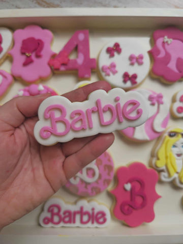 Pink Barbie character fondant cookies made by LCS Creative for themed parties and birthday
