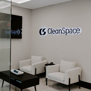 Image of a whilte office with white floors and white couches