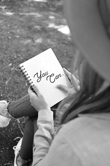 Courtney Lavin LPC overlooking a journal used in Oak and Ivy Counseling's therapy for women in life transitions, anxiety, motherhood, and career direction.