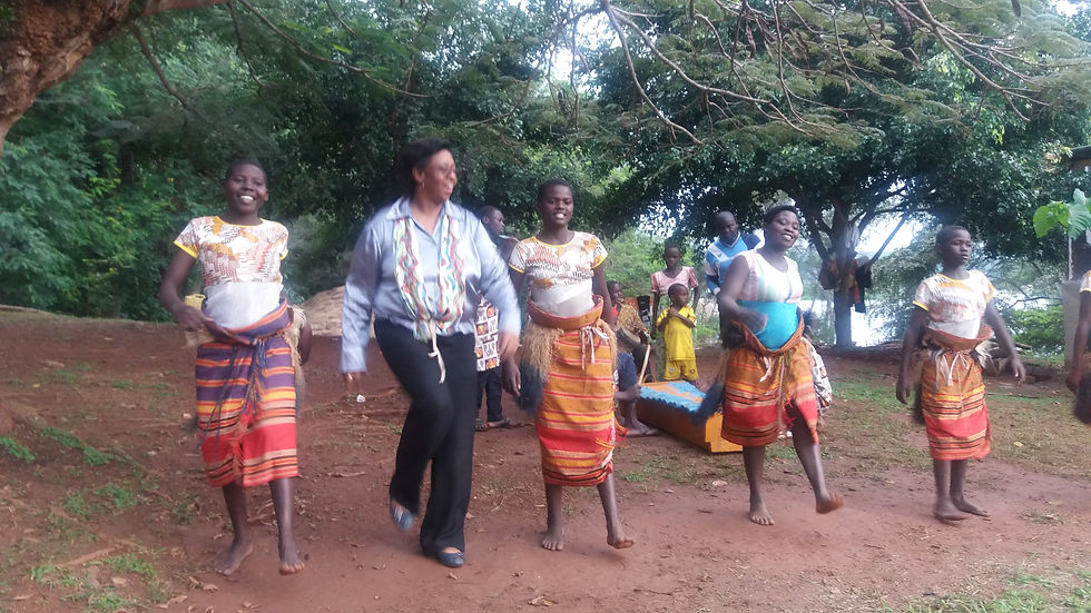 Dancing with young women near the River Nile in Uganda.jpg