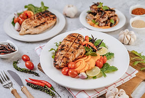chicken-steak-with-lemon-tomato-chili-carrot-white-plate.jpg