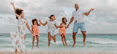 Neurodivergent family relaxing on a sensory-friendly beach vacation