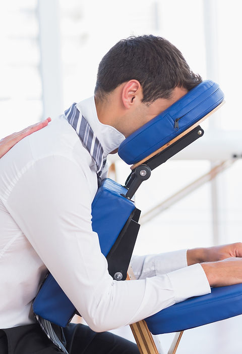 Businessman having back massage in medical office.jpg