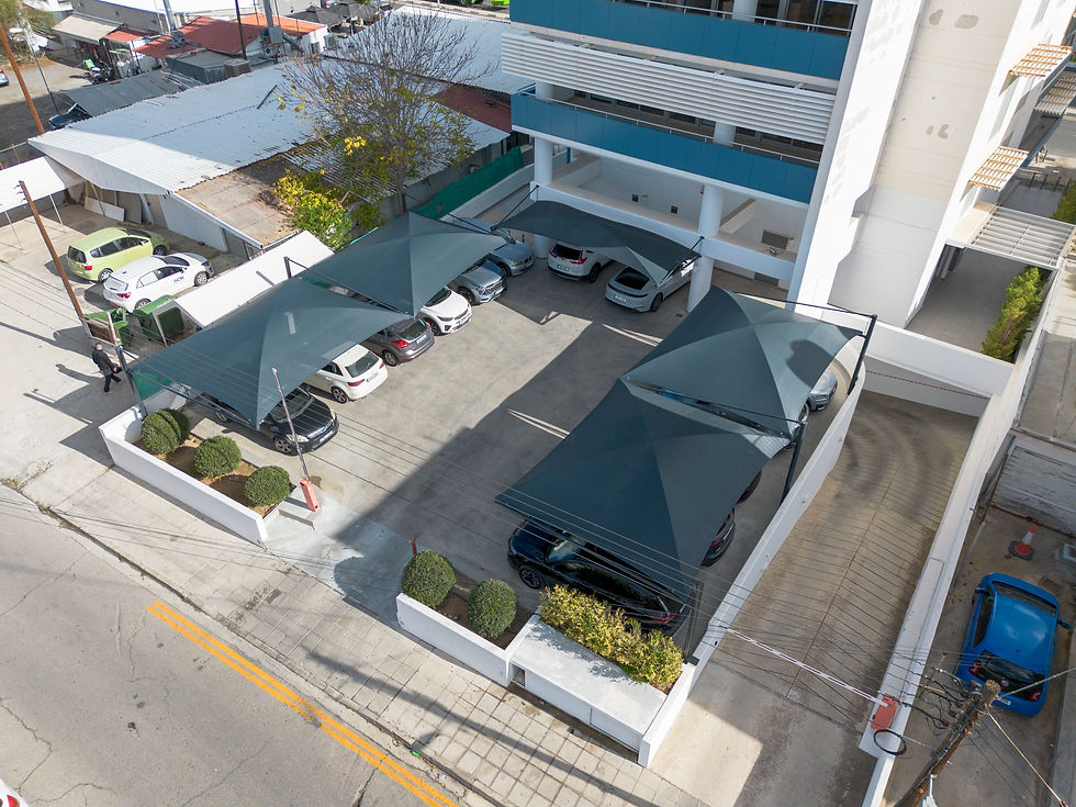 Zeus carports Cyprus, commercial carports Nicosia, office parking shade structures, ATOS Nicosia, charcoal carport modules, parking canopy systems, corporate parking solutions, shade structures Cyprus, vehicle protection systems, modern carports.