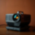 a projector with a brown background.jpg