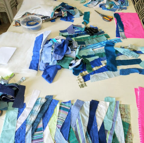 fabric strips laid out on a table