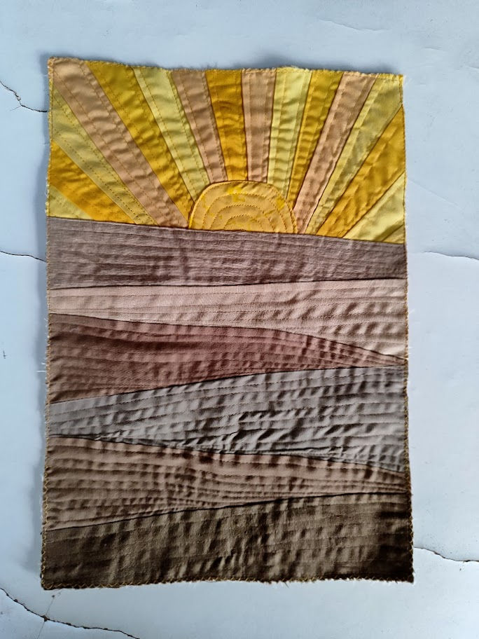Thumbnail: a brown and yellow art qult