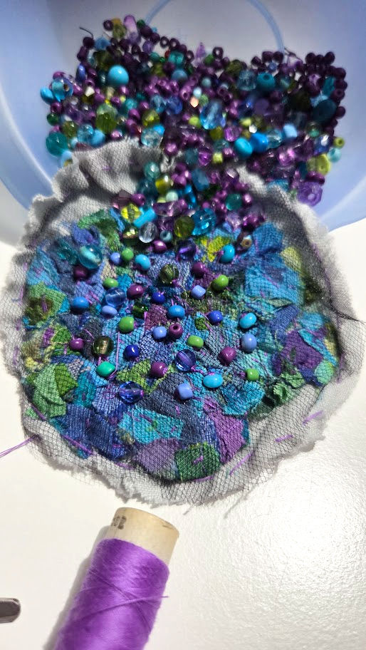 slow stitching on scrap fabric with threads and beads