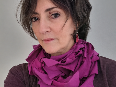 Woman wearing fuschia colored t shirt scarf