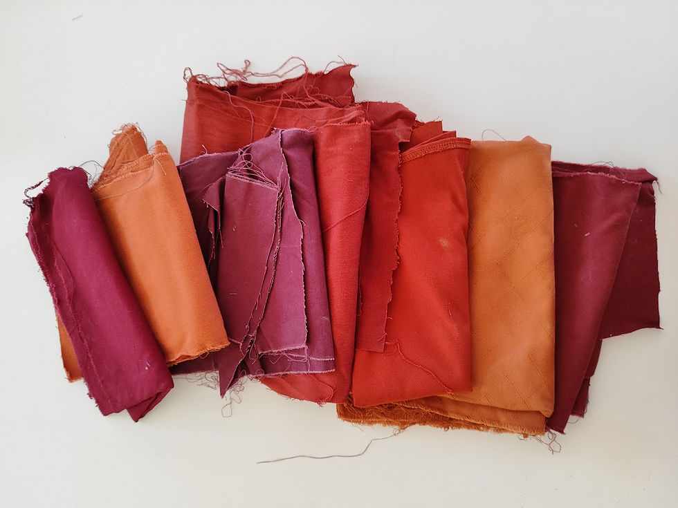 orange, plum and rust colored fabric pieces