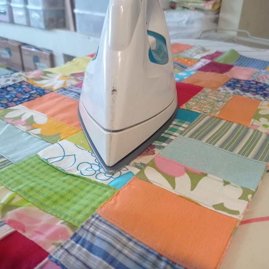 Thumbnail: ironing a patchwork fabric piece