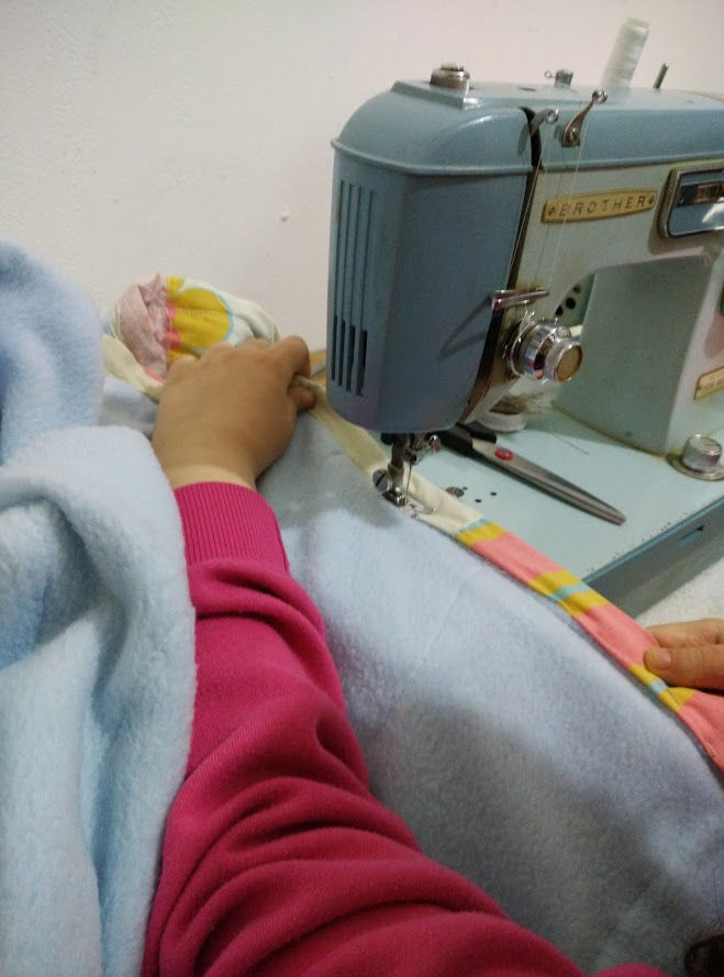Top stitching the binding