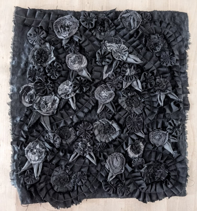 Black and grey roses on black satin