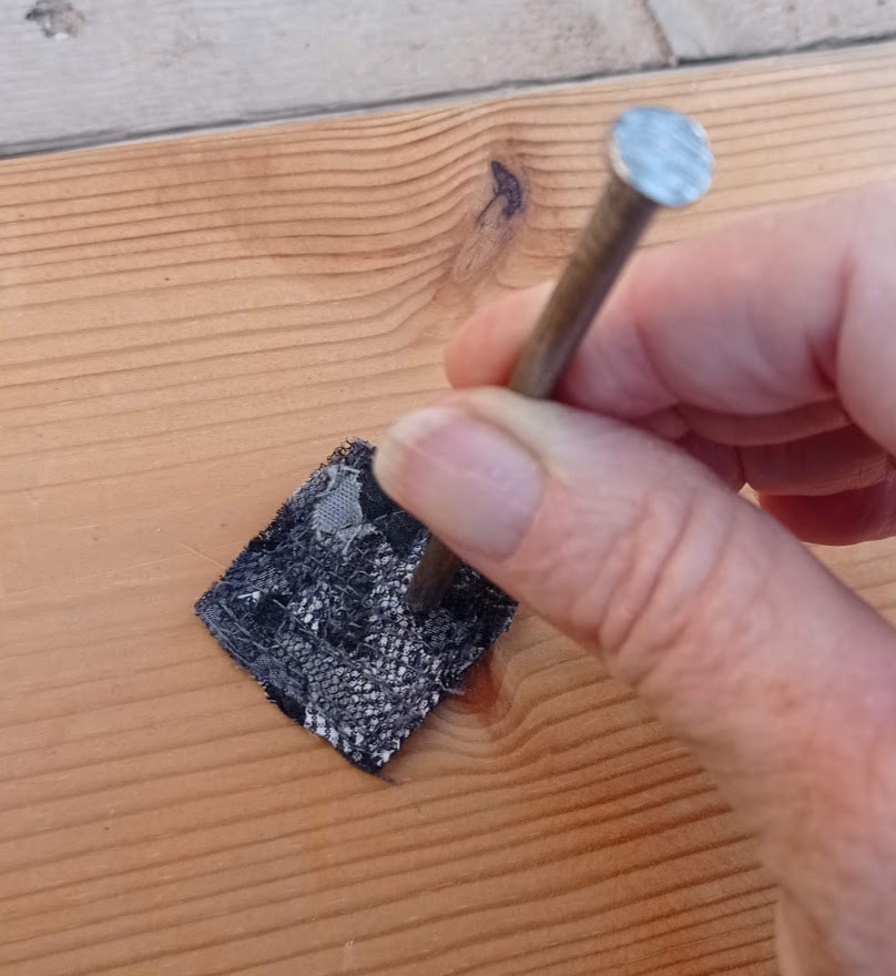 Press the nail down