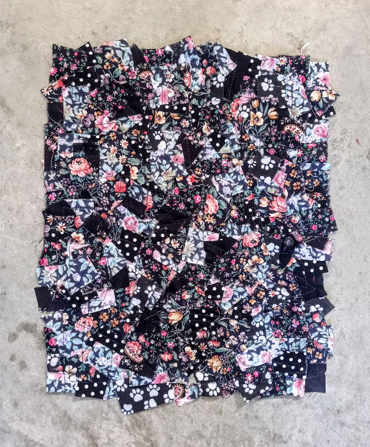 A new piece of patchwork fabric made from very small pieces