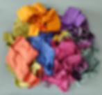 Thumbnail: pile of fabric strips in orange blues pinks greens and yellow