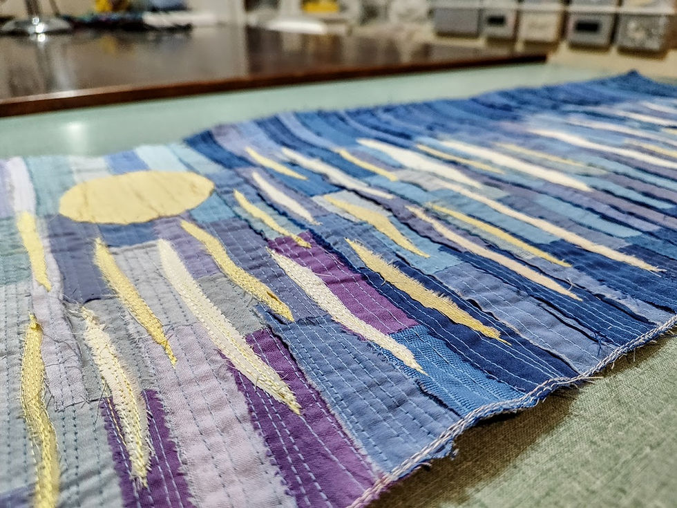 Thumbnail: moonlight patchwork art piece lying on a table