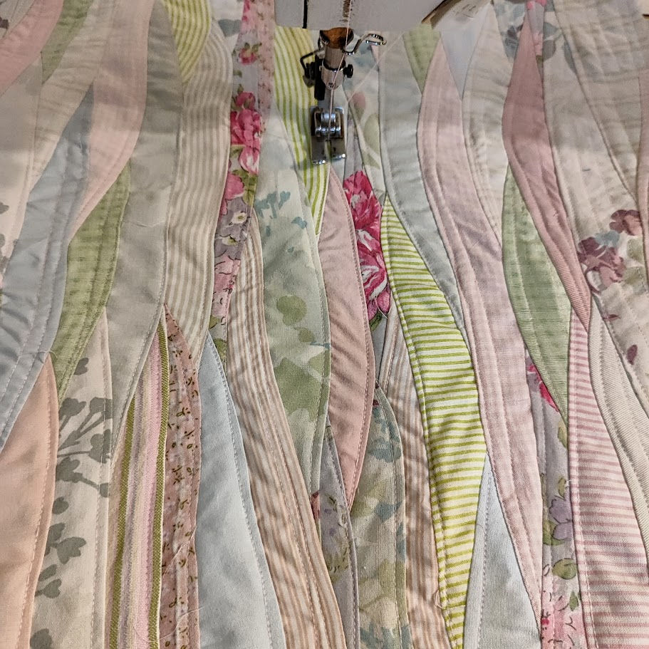 Thumbnail: quilting an art quilt on a sewing machine