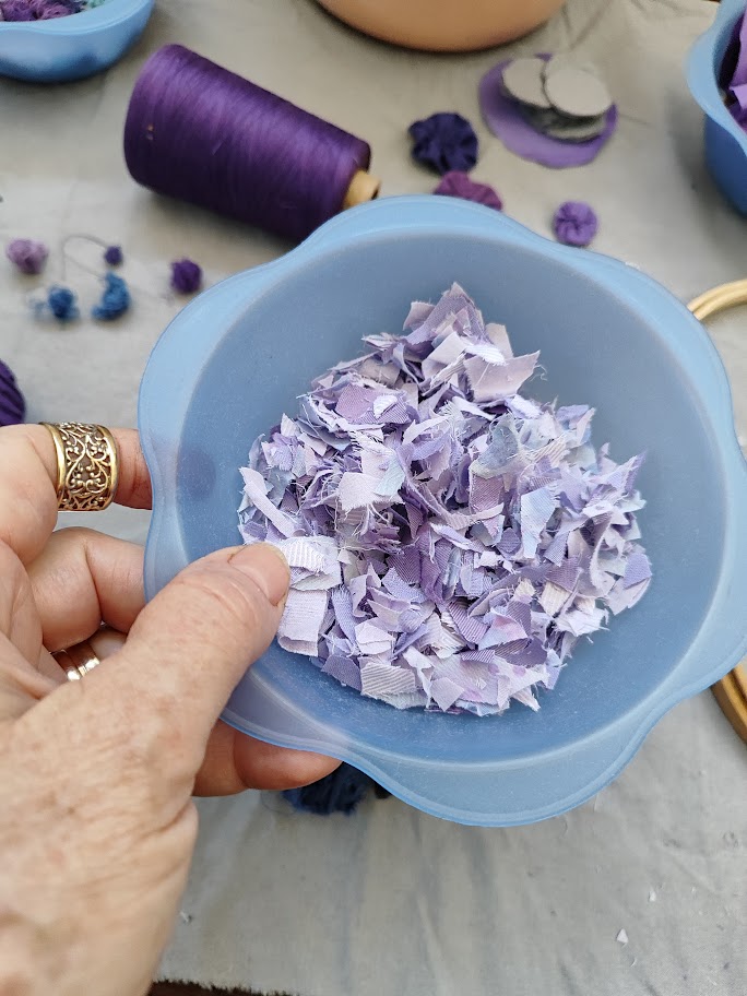 scrap fabric pieces in a blue bowl