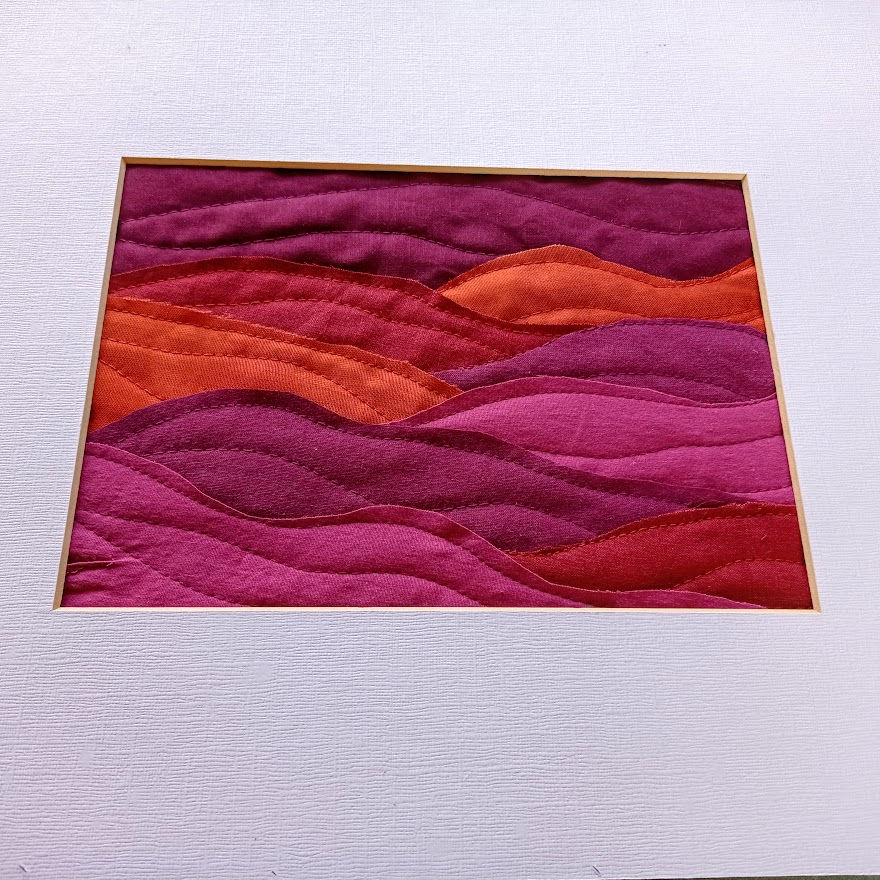 Thumbnail: quilted fabric landscape in plum and orange shades