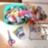 summer colored fabric scraps in a bowl near a sewing machine