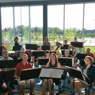 a group of people with music stands and instruments