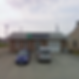 exterior of the building in Thompson with two cars parked outside