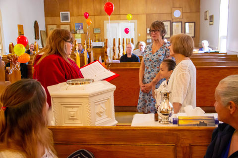 Sharing a message during a baptism service.