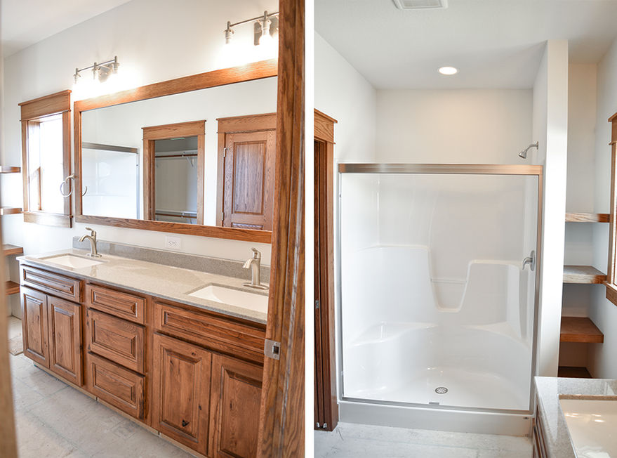 Onyx vanity with Venetian white sink bowls, Moen faucets, and walk-in shower with shelves beside.