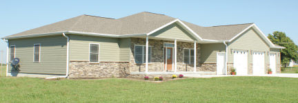Cottonwood modular home built by Wardcraft with custom masonry and 3-car garage.