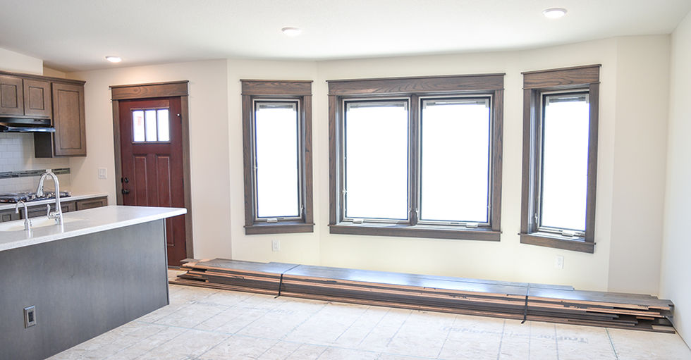 Extended living area with casement windows near kitchen.