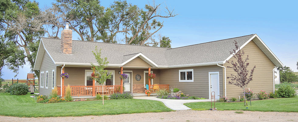 Wardcraft prefab home with porch and exterior white trim.