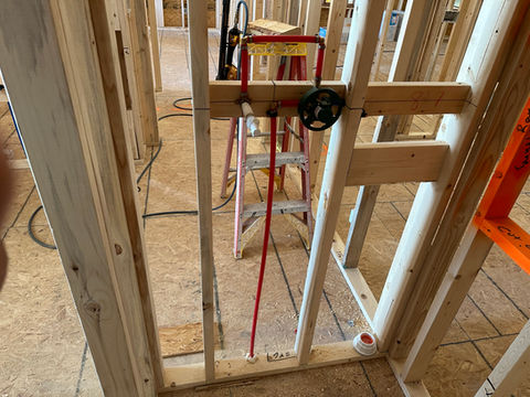 Bathroom shower plumbing with valve.