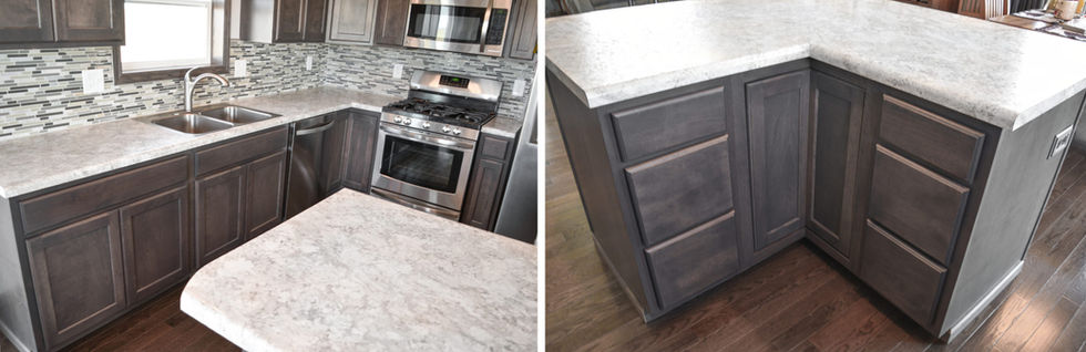 Kitchen cabinets below countertop and island countertop.