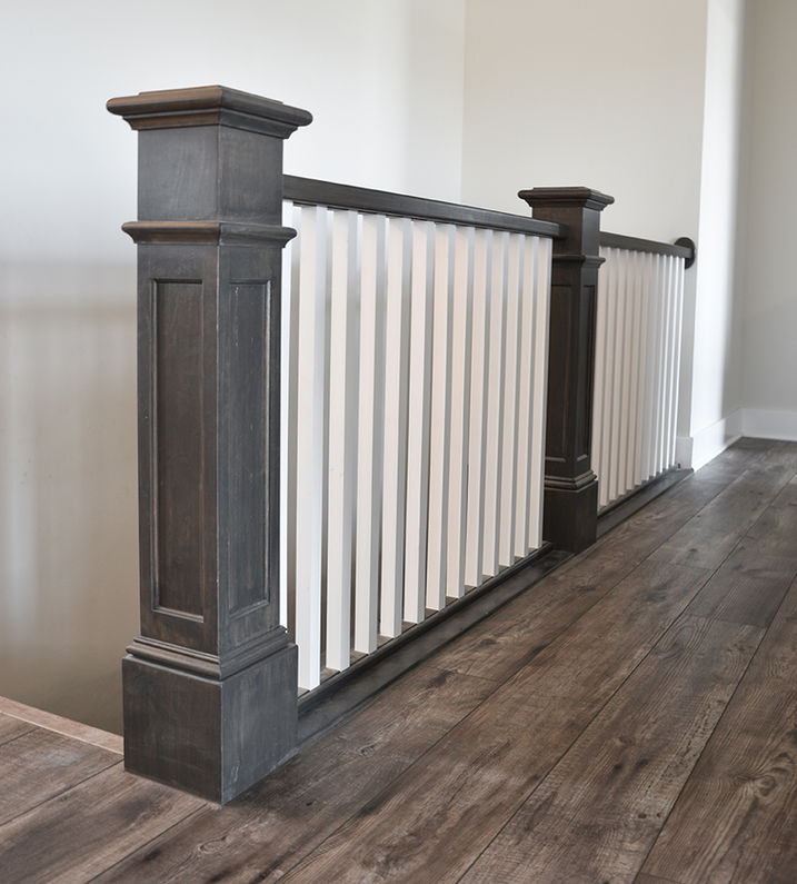 Diller dark gray and white Craftsman Railing by stairs.