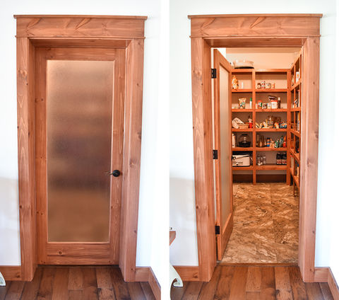 Hays Large walk-in L-Shaped Pantry with Pine shelves.