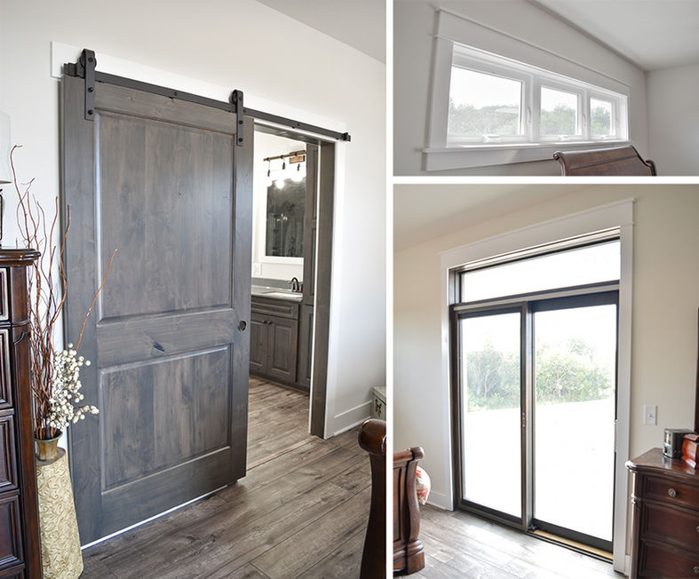 Master bedroom with barn door to bathroom, sliding patio door, and high casement windows.