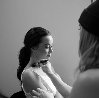 Makeup Artist prepping a bride for her wedding day