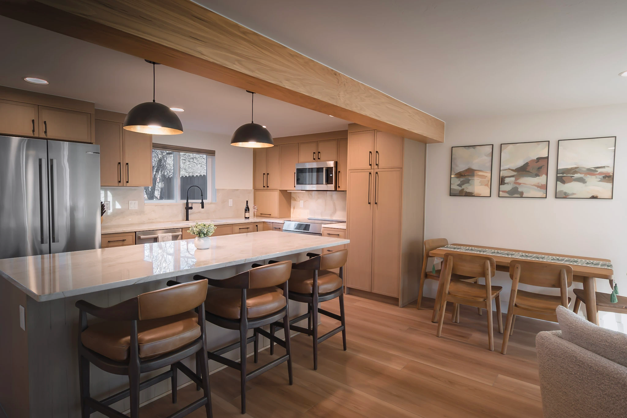 Modern kitchen with large island and adjacent dining area