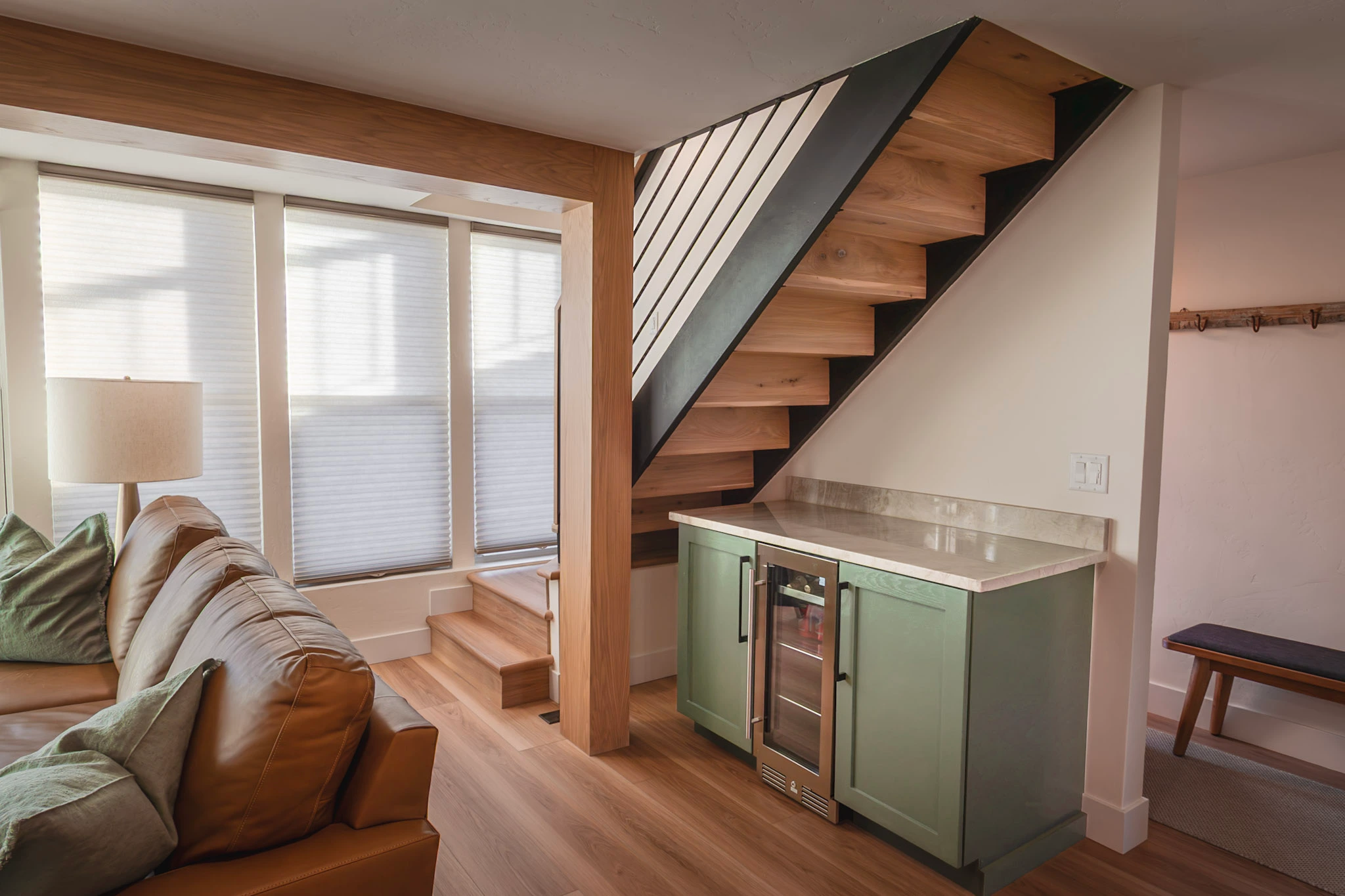 Modern open staircase with wet bar