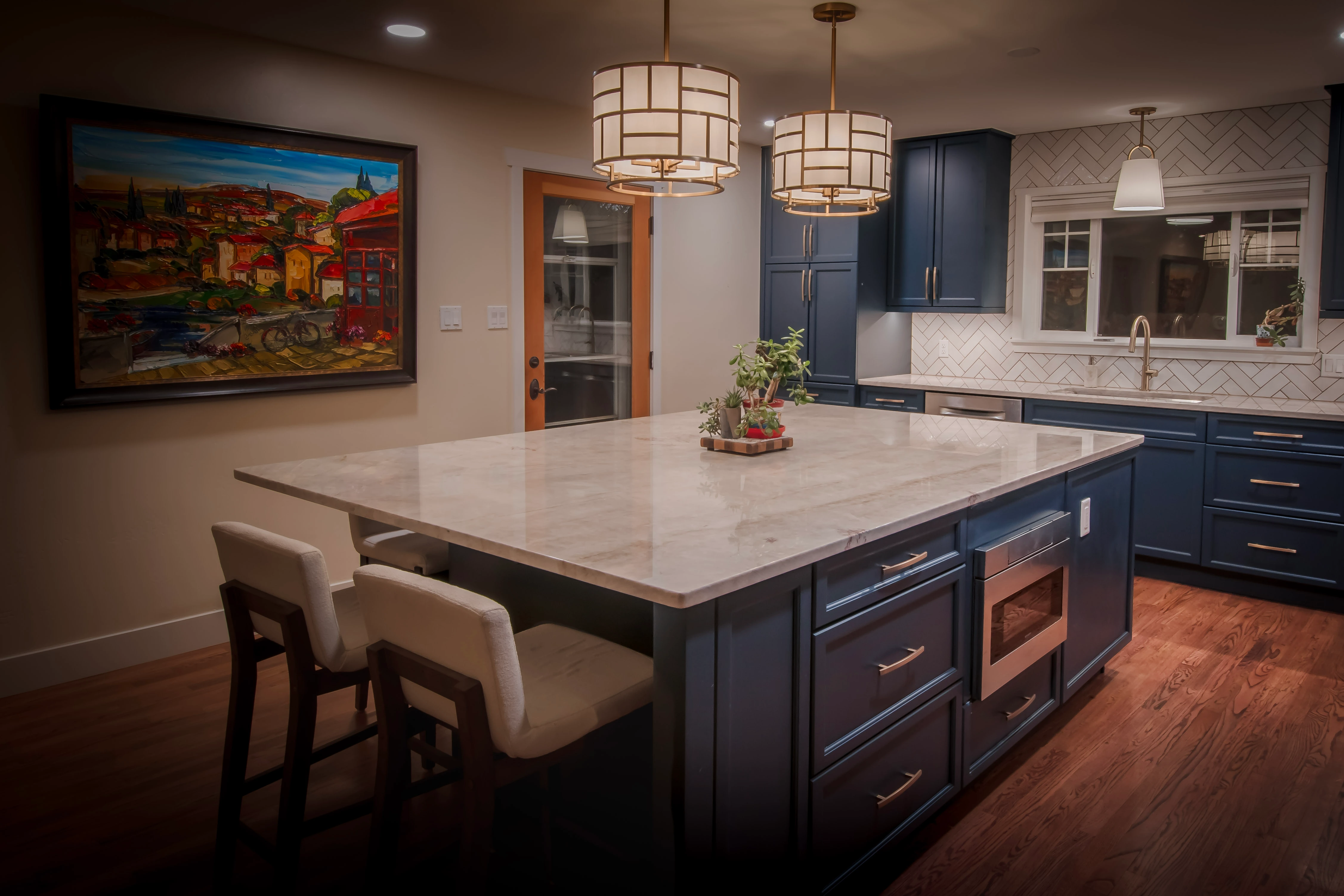 Modern kitchen with large island and dark cabinets