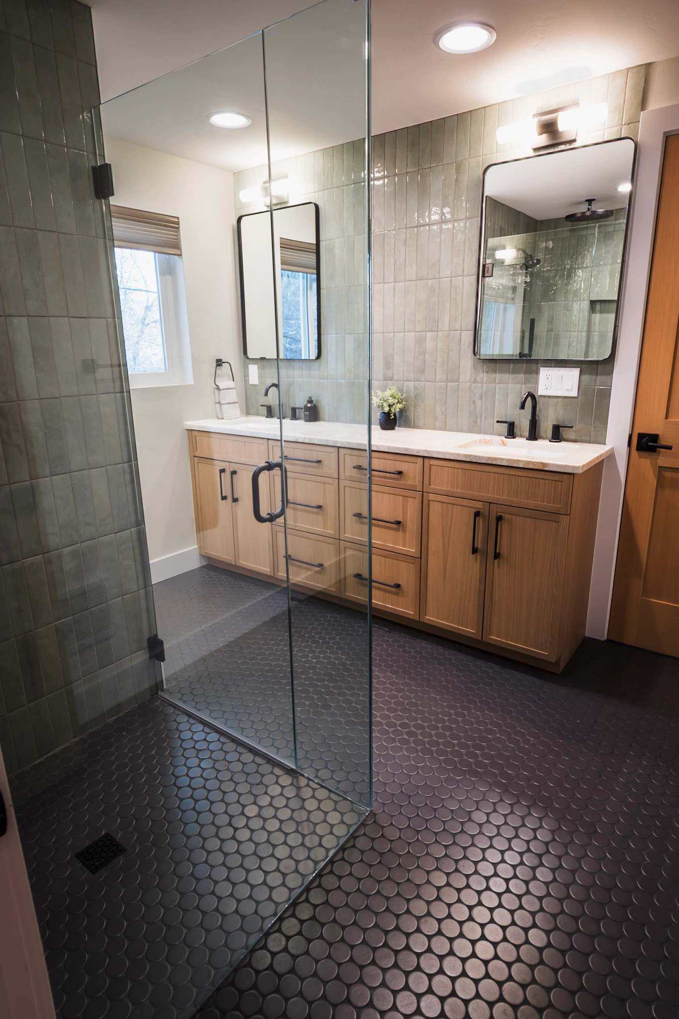 Modern bathroom with glass shower and double vanity