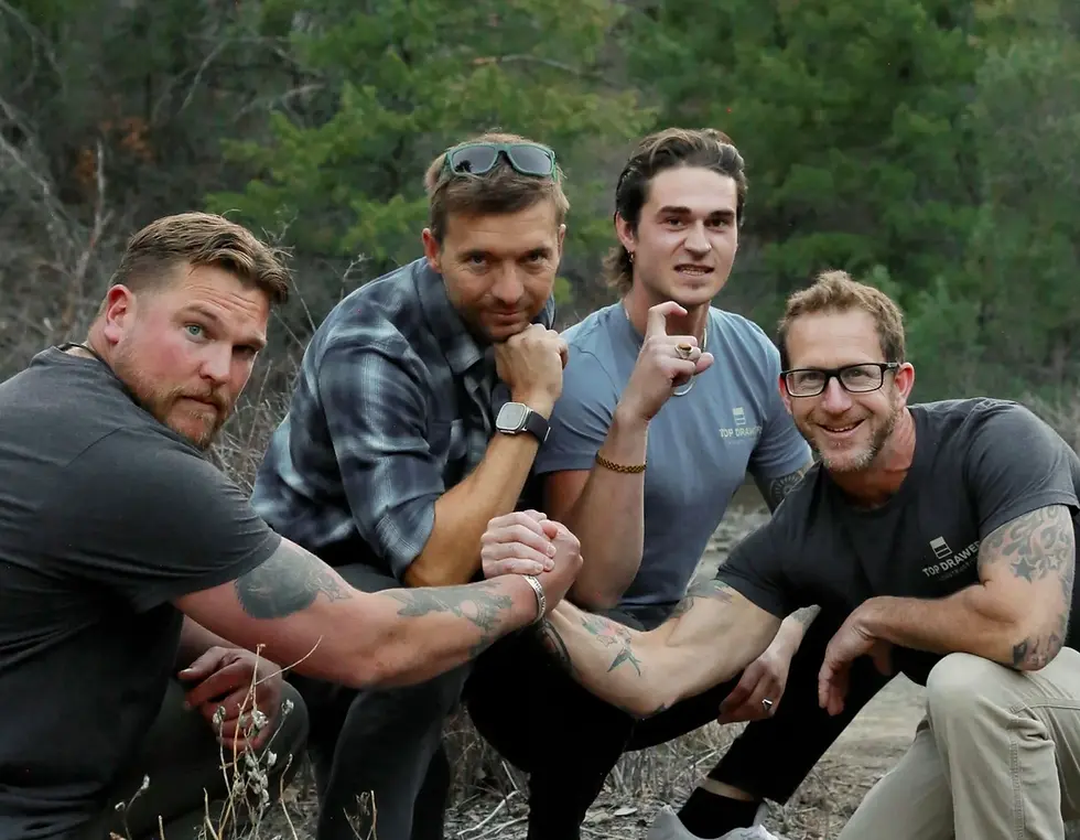 Silly group photo of the Top Drawer team.