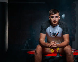 Young man posing in a gym for a sports photoshoot