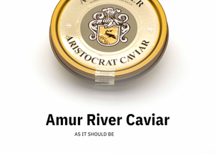 Warm blini topped with crème fraîche and Aristocrat caviar, a traditional caviar serving style