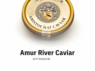 Warm blini topped with crème fraîche and Aristocrat caviar, a traditional caviar serving style