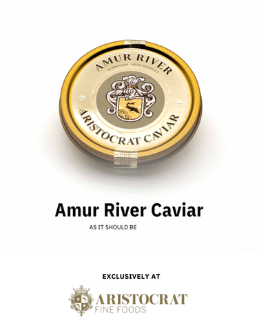 Warm blini topped with crème fraîche and Aristocrat caviar, a traditional caviar serving style