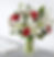 Bouquet of red roses and white lilies in a vase next to a book